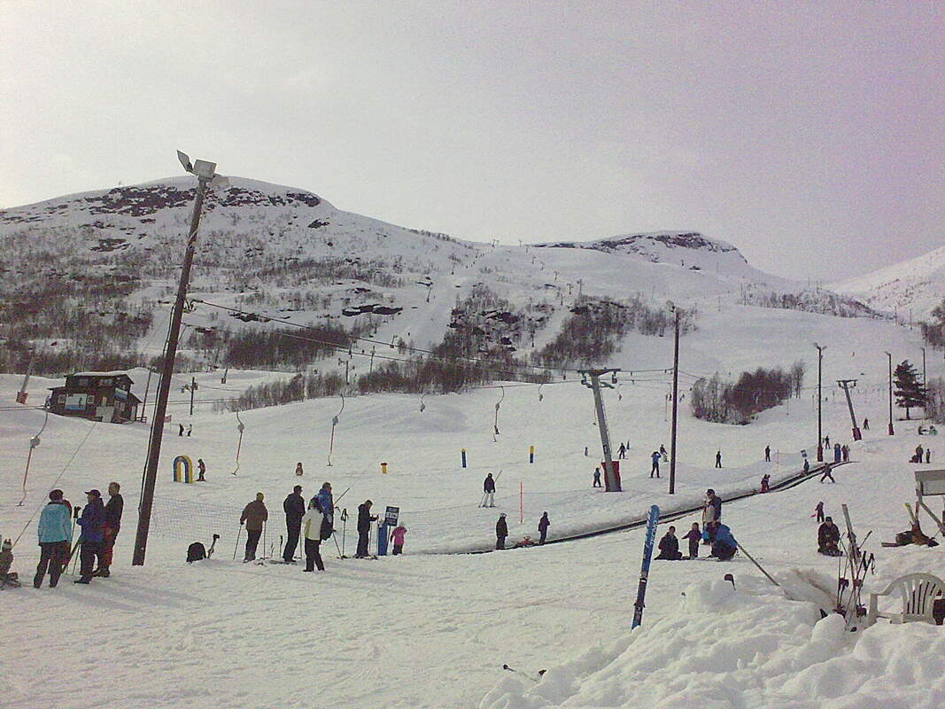 Arena Overøye – Stordal in Norway - a group of people standing in the snow.