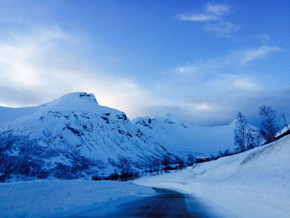 Arena Overøye – Stordal in Norway - a snowy road with mountains in the background.