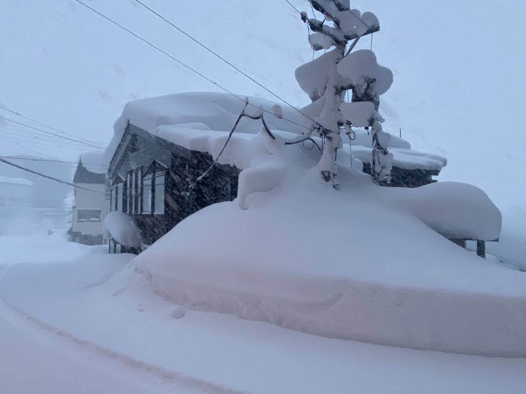 Jibuzaka Kogen in Japan - snow on the roof of a house.