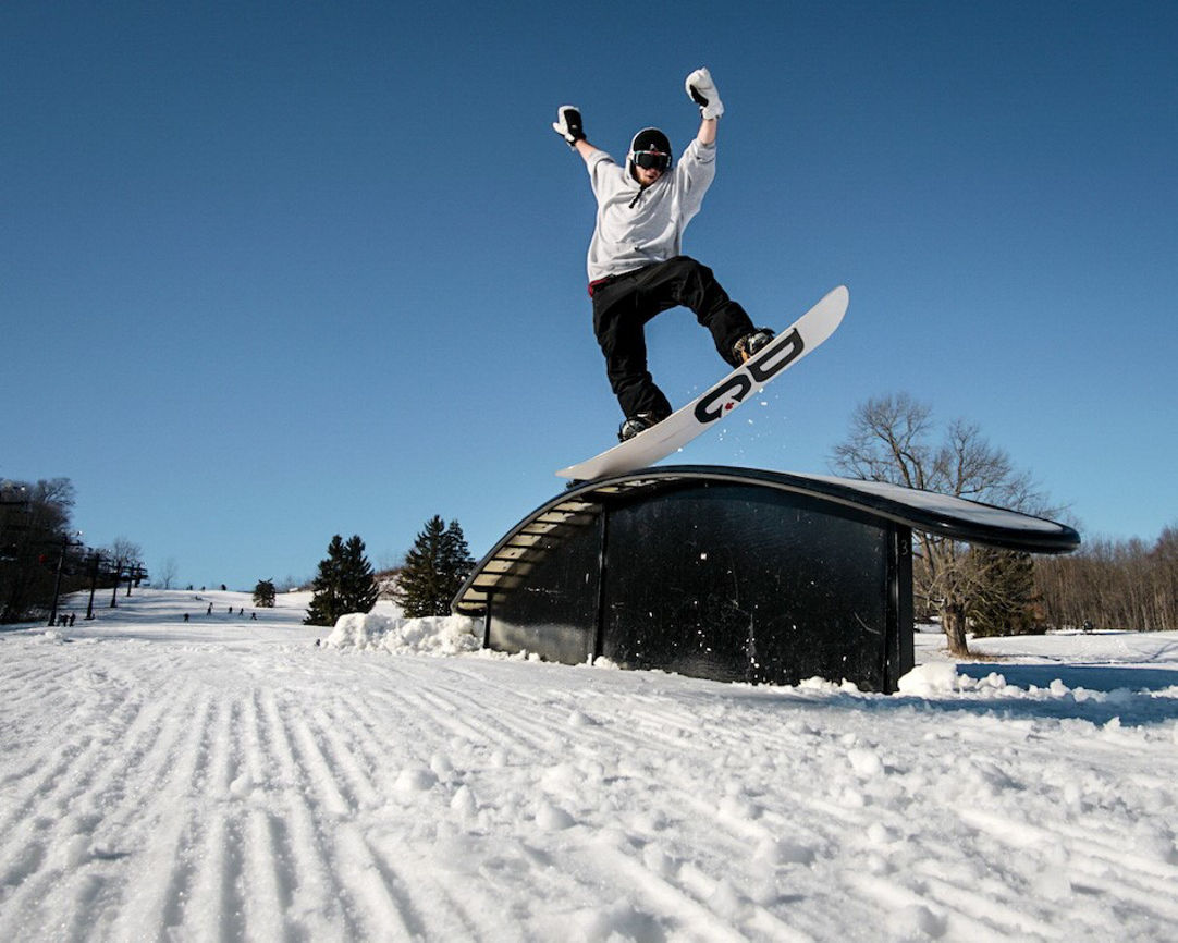 Alpine Valley Ohio in USA - a person on a snowboard jumping in the air.