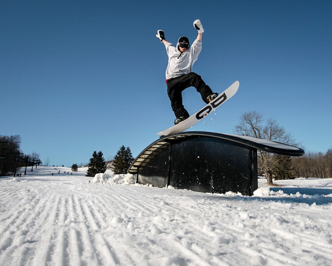 Alpine Valley Ohio in USA - a person on a snowboard jumping in the air.