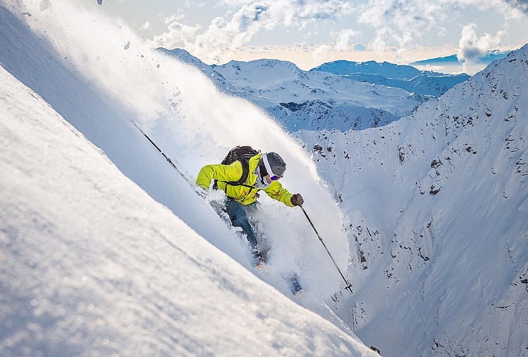 Temple Basin in New Zealand - a person skiing down the side of a mountain.