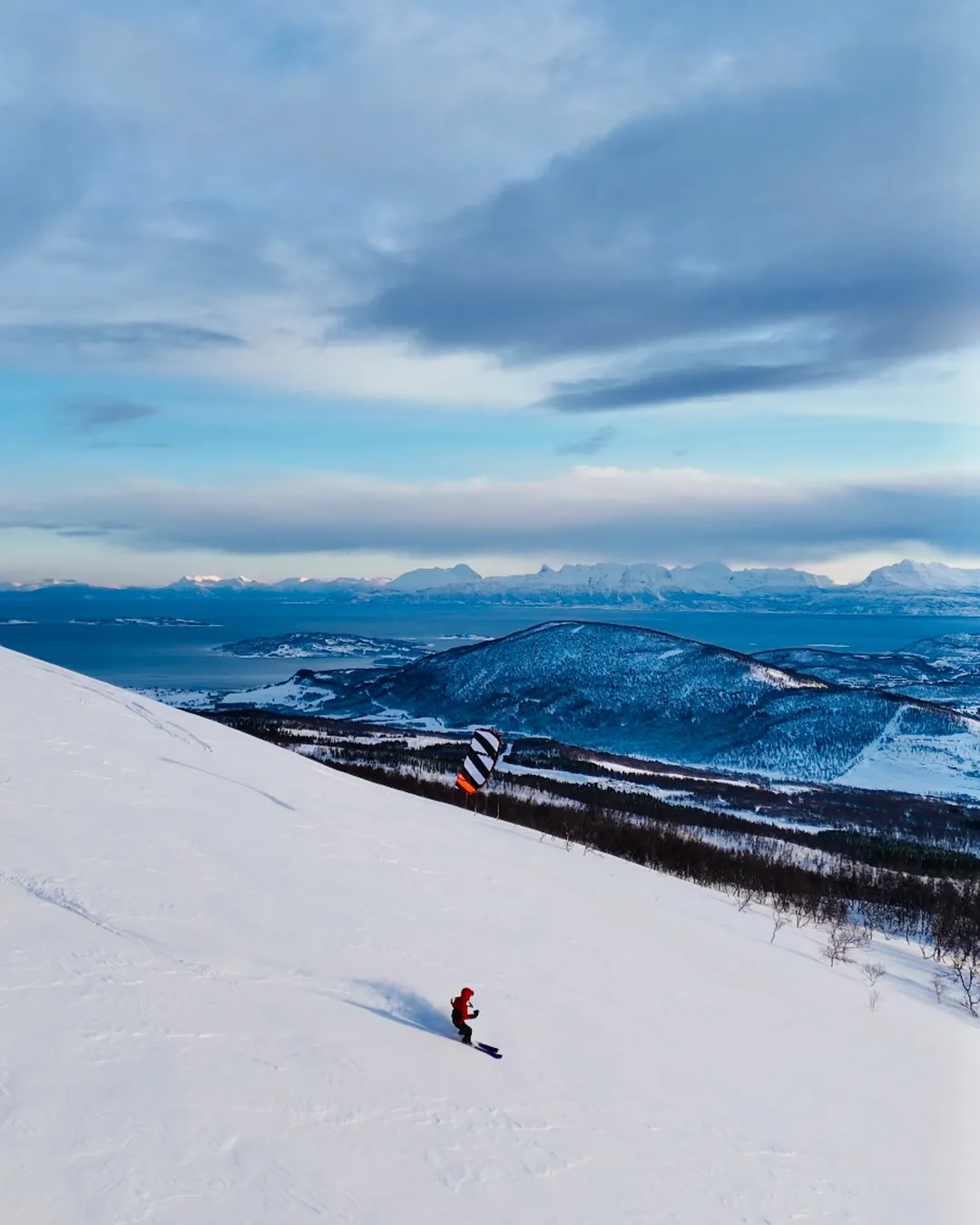 Sollifjellet in Norway - a person skiing down a snow covered mountain.