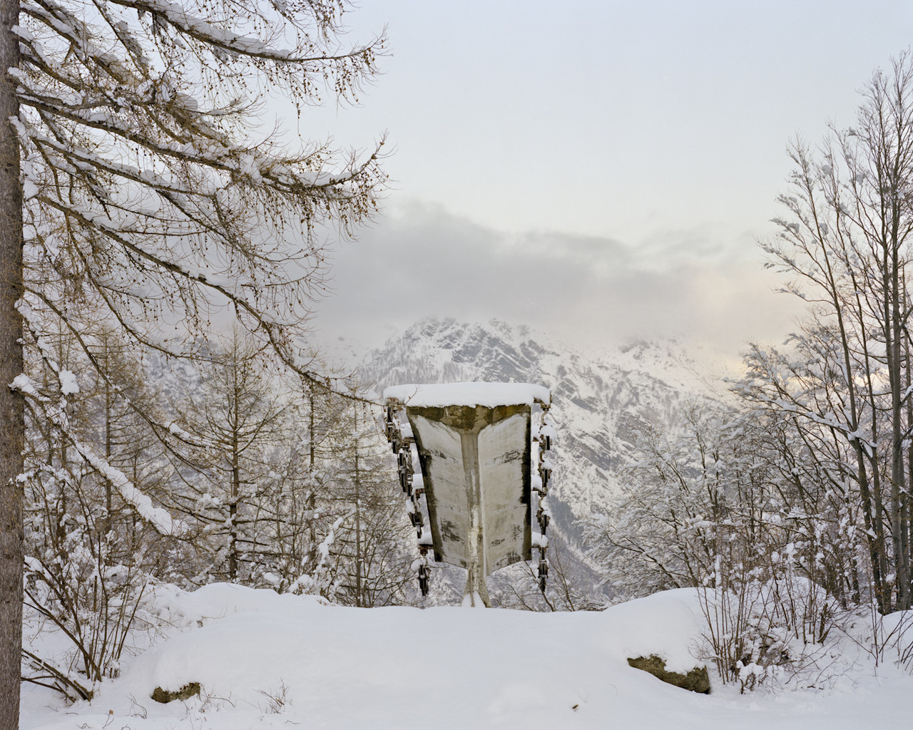 Alpe Cialma – Locana in Italy - a tent in the middle of a snowy forest.