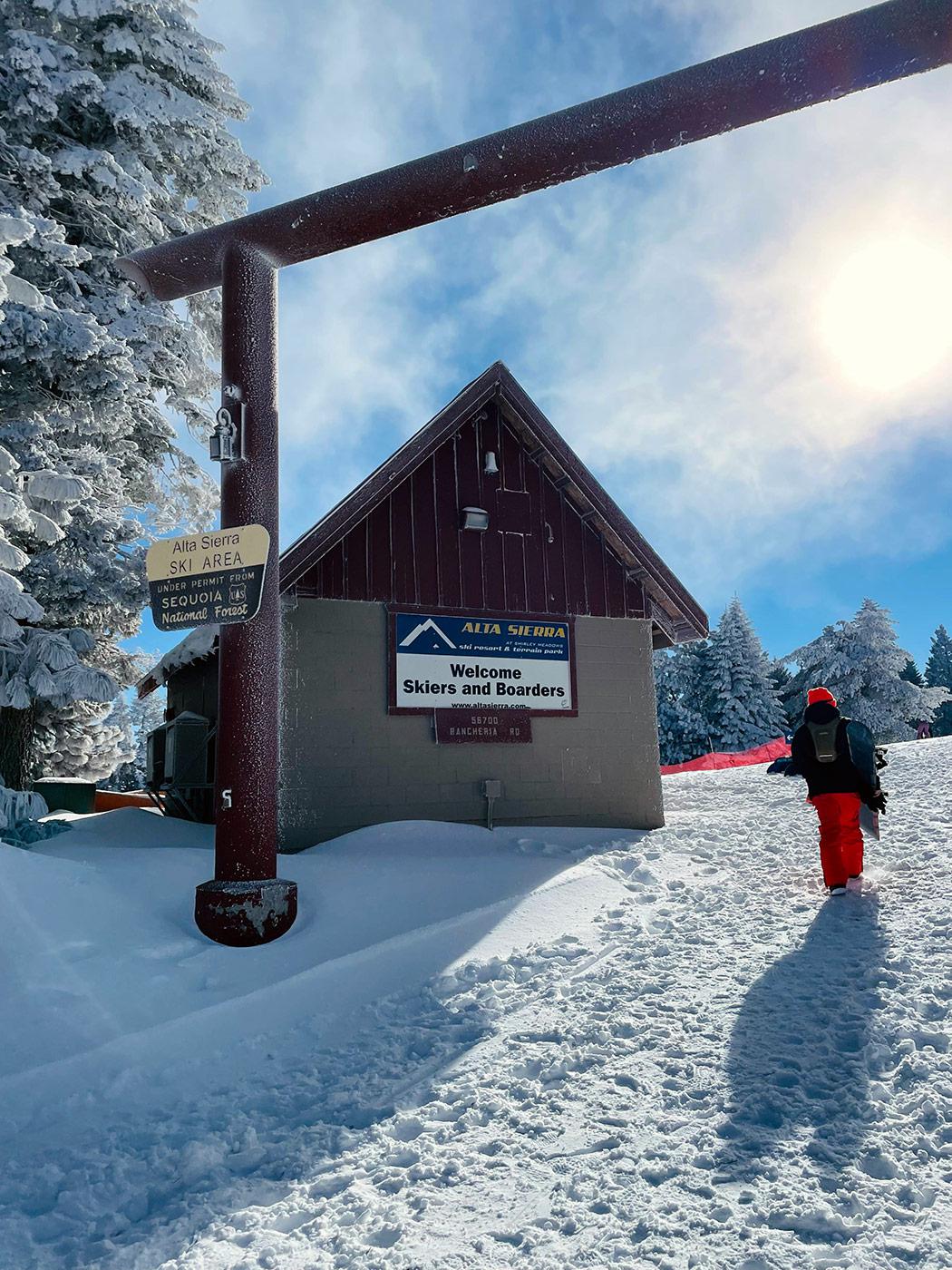 A ski resort scene at Alta Sierra California highlighting winter activities. Features a ski lodge lift system and enthusiasts enjoying winter sports.