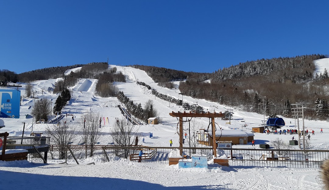 Stoneham in Canada - a snow covered ski slope in the mountains.