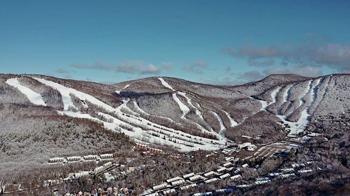 Stoneham in Canada - a view of the mountains from the top of a mountain.