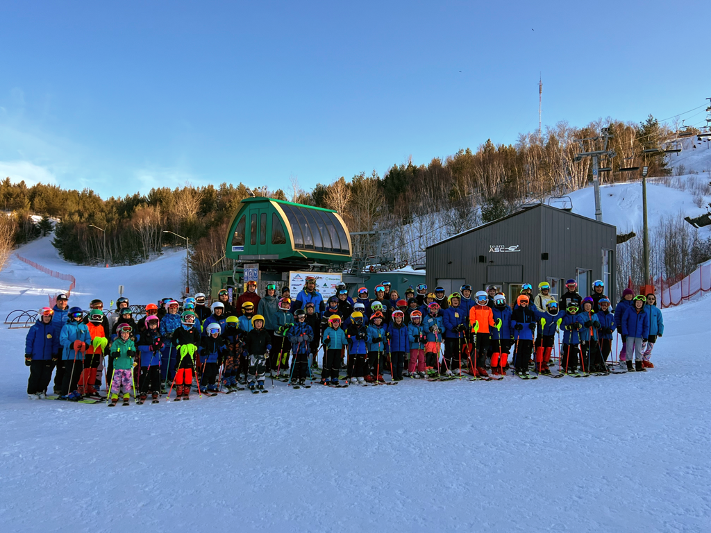 Adanac Ski Hill in Canada - a group of people standing in the snow.