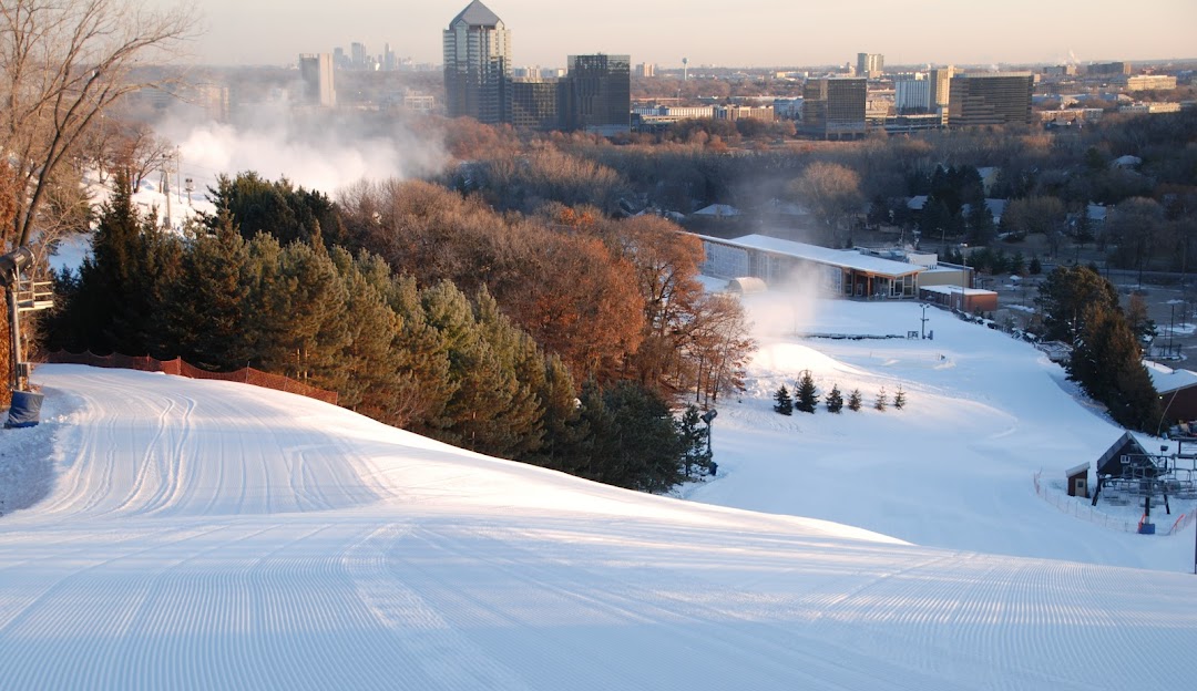 Image of Hyland Hills showcasing a lively winter sports scene in Minnesota USA. Visible are the snowy slopes of the ski resort surrounded by beautiful winter scenery.