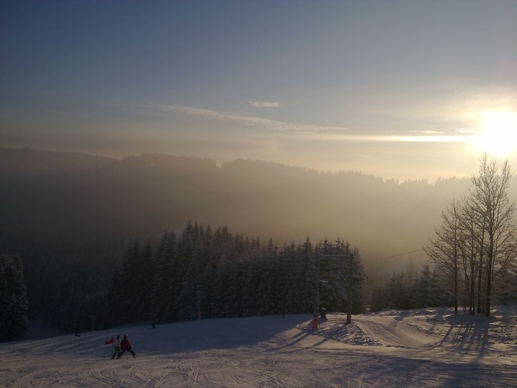 Grúň – Staré Hamry in Czech Republic - a group of people skiing down a mountain.