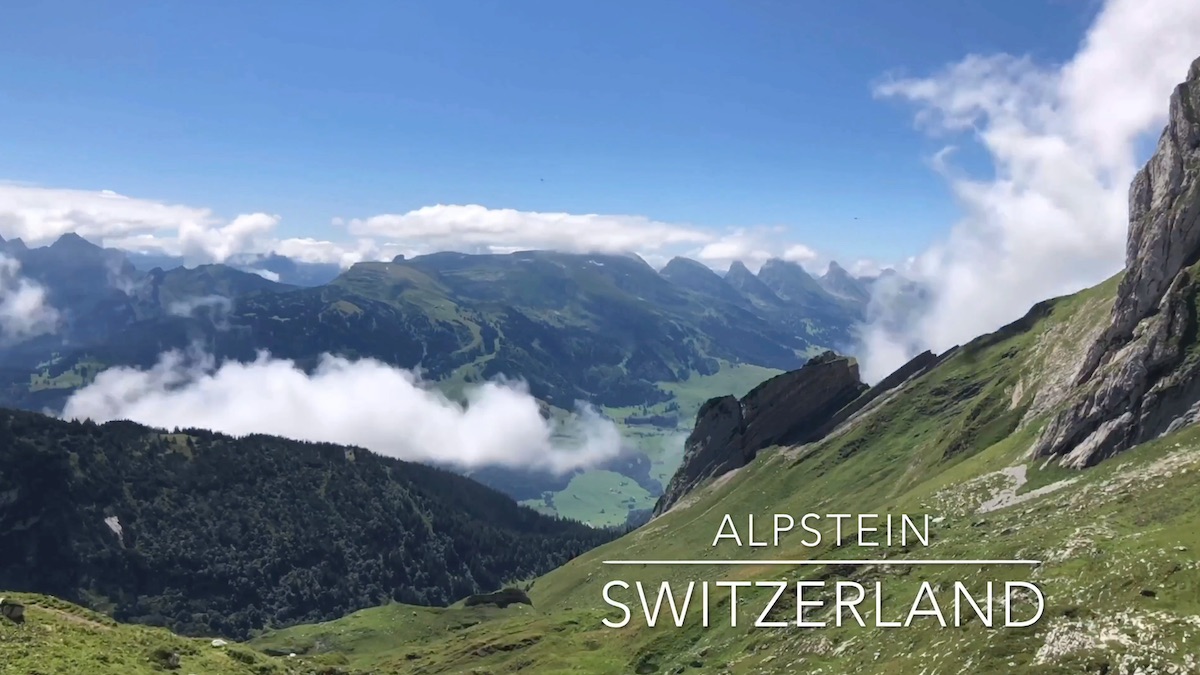 Sollegg – Appenzell in Switzerland - a view of mountains and clouds with the words alpine switzerland.