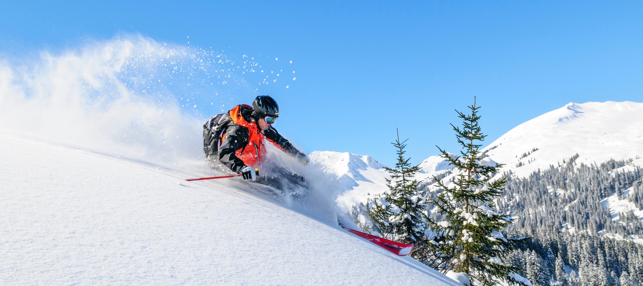Spieserlifte – Unterjoch in Germany - a person riding a snowmobile down a snowy slope.