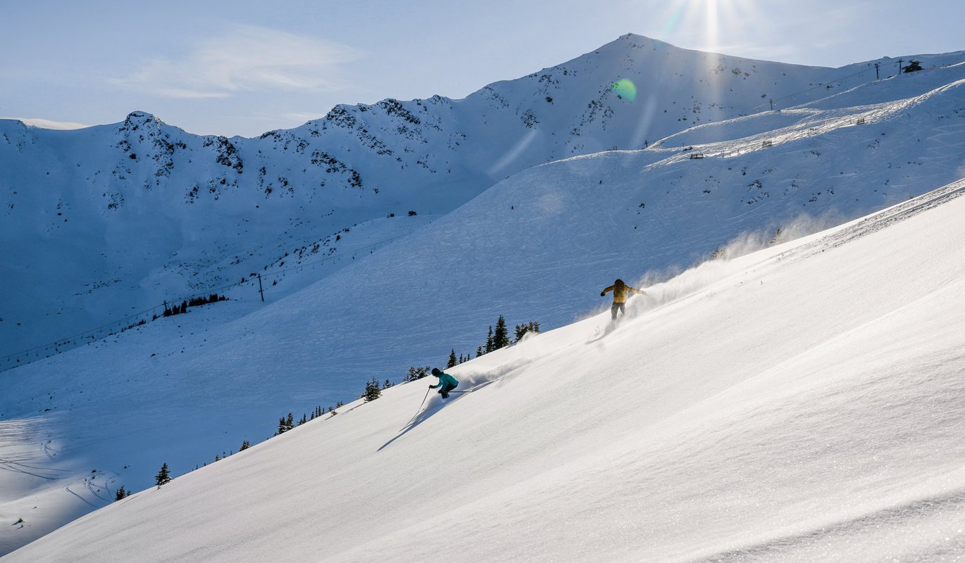 Marmot Basin in Canada - a person skiing down the side of a mountain.