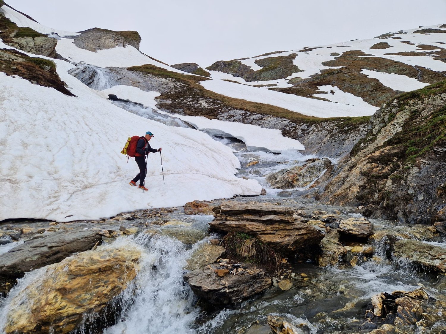 Mont Bellevue in Canada - a person walking across a stream in the snow.