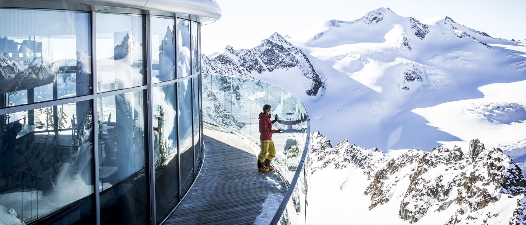Pitztal Glacier in Austria - a woman standing on top of a snow covered mountain.