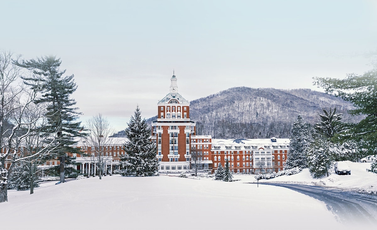 Winter scene at The Omni Homestead in Virginia, featuring a stunning snowy landscape used for winter sports such as skiing.