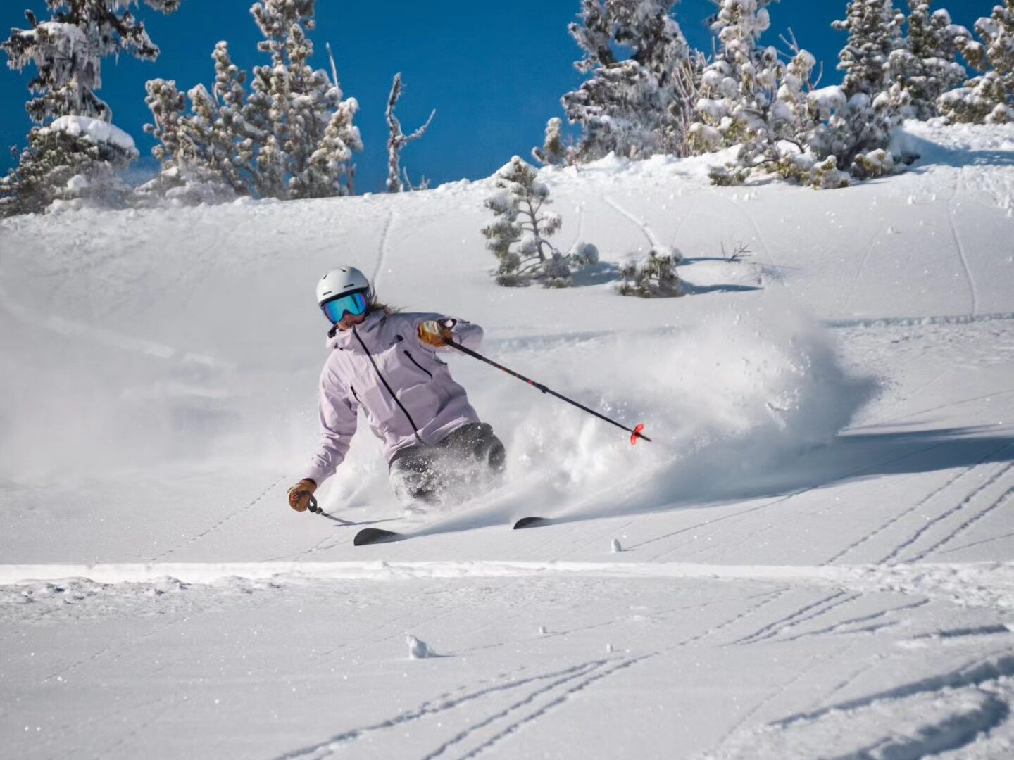 Madarasi Hargita in Romania - a person skiing down a snow covered slope.
