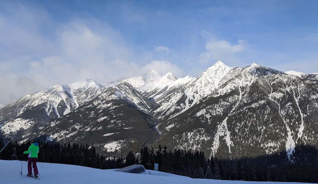 Kimberley in Canada - a person skiing down a snow covered mountain.