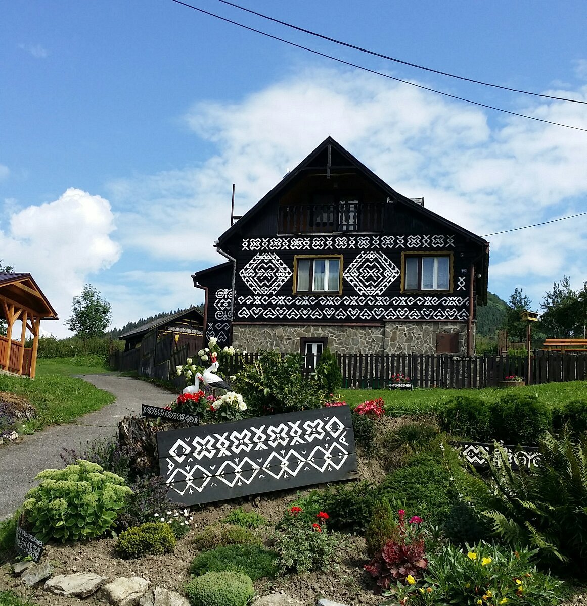 Fačkovské sedlo in Slovakia - a house with a sign in front of it.