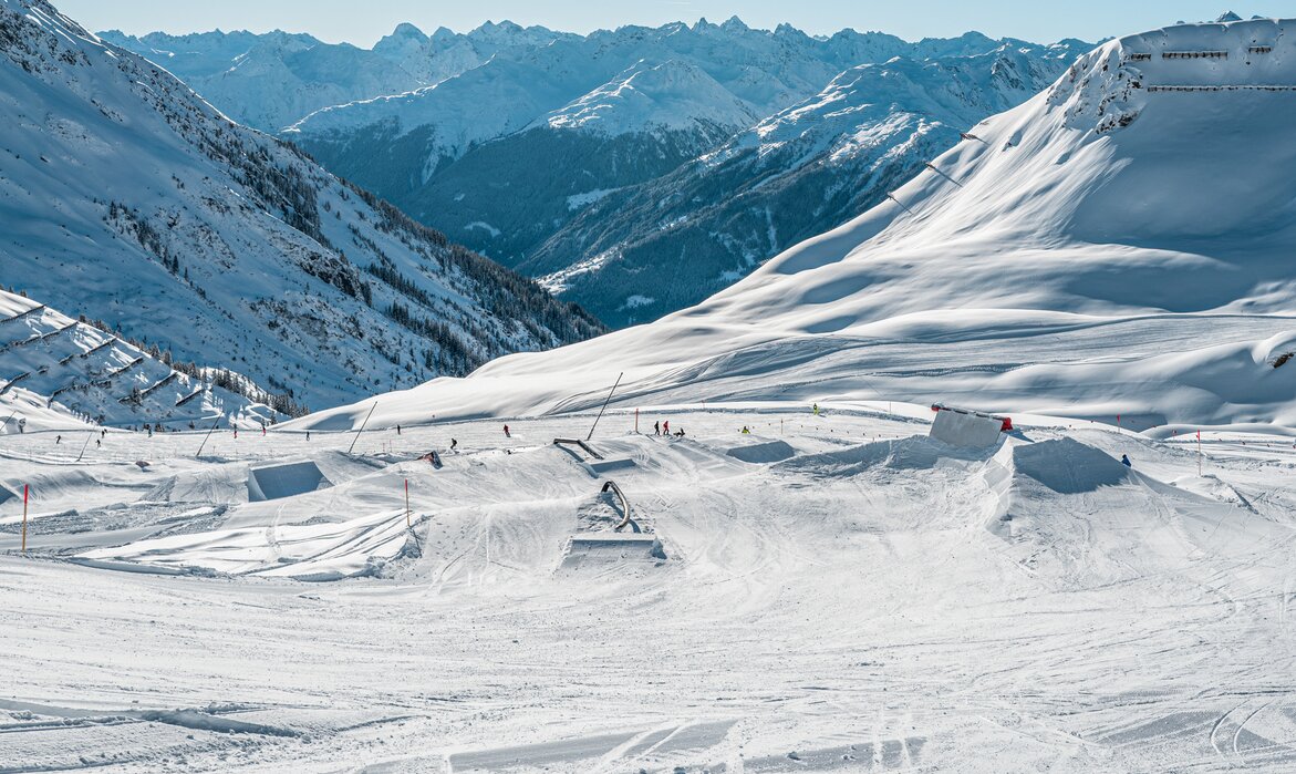 Silvretta Montafon in Austria - a group of people skiing down a snowy slope.