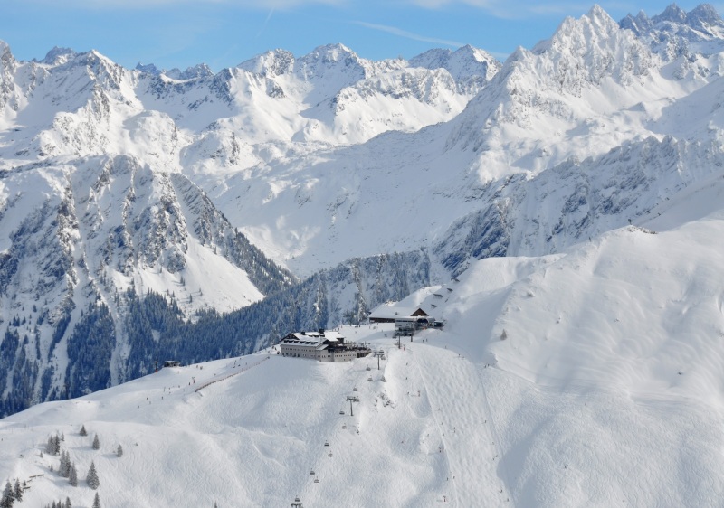 A charming chalet at the tranquil Silvretta Montafon ski resort in Bludenz Austria. Spectacular winter sports scene with a bustling ski center and a quaint mountain hut.