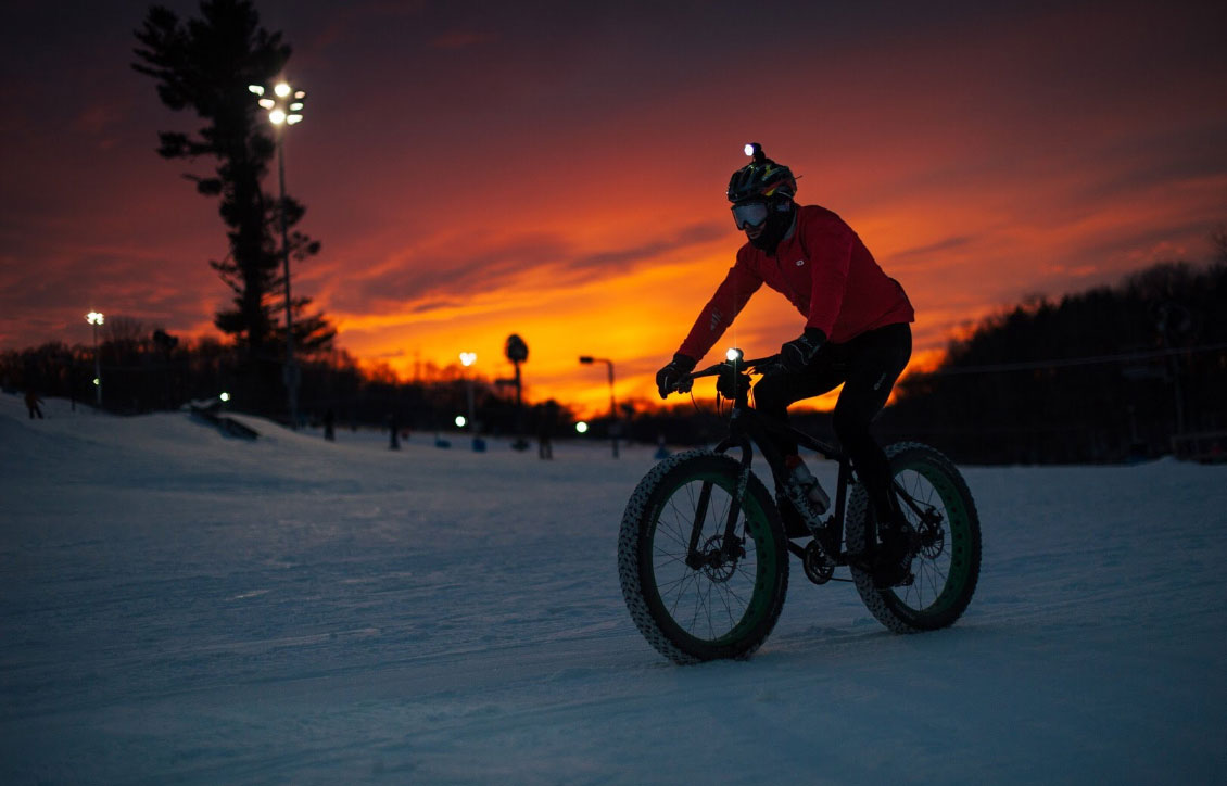 Cannonsburg in USA - a man riding a bike down a snow covered slope.