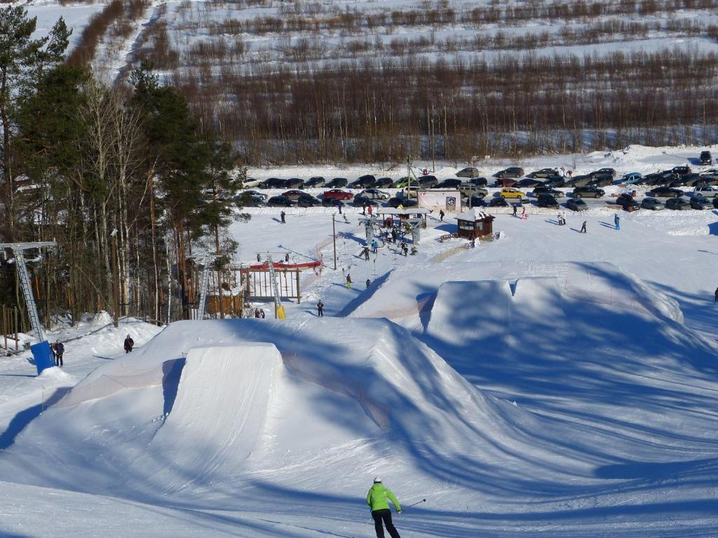 Zolotaya Dolina in Russia - a person skiing down a hill in the snow.