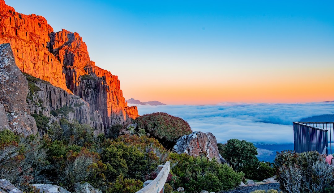 View of the majestic Ben Lomond mountain in Tasmania, Australia, featuring a quaint chalet nestled amongst the landscape. A captivating winter scene showcasing Australia's stunning natural beauty.