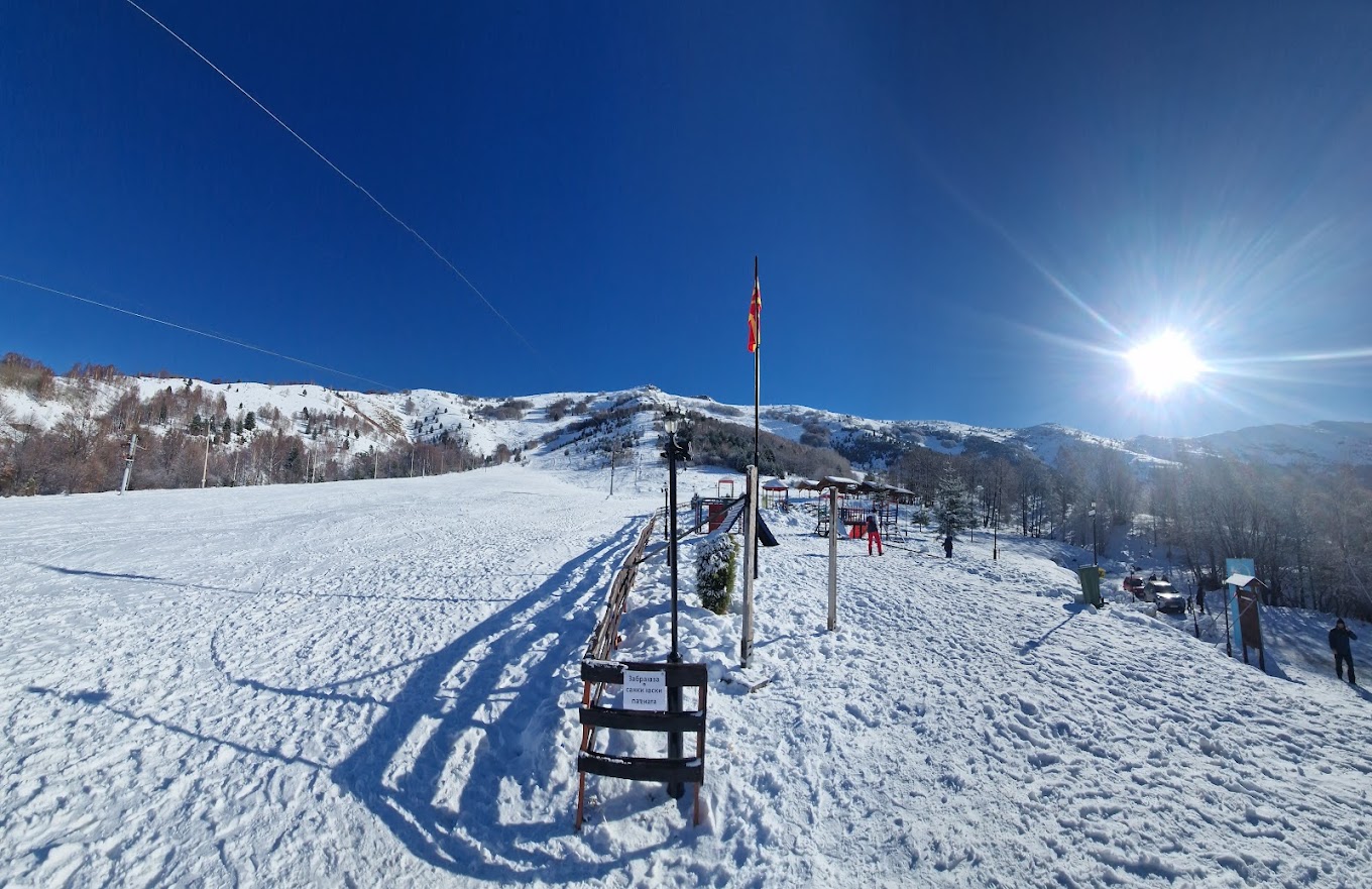 Nizhepole in North Macedonia - the sun is shining over the snow covered slopes.
