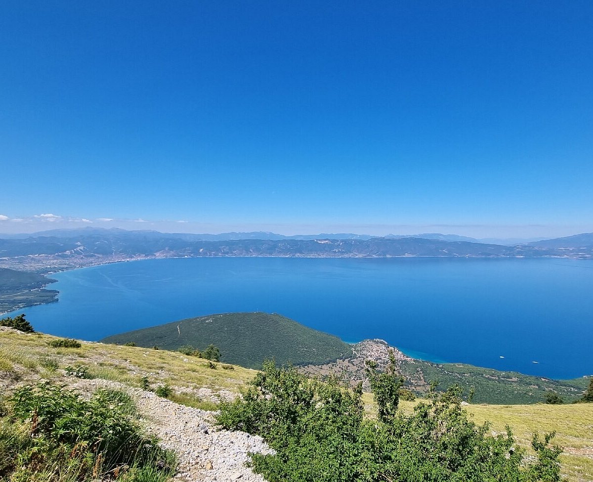 Nizhepole in North Macedonia - a view from the top of a mountain with a lake in the distance.