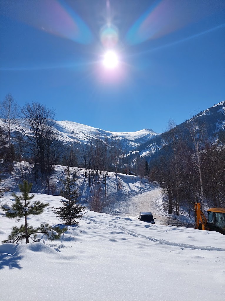 Nizhepole in North Macedonia - the sun is shining over the snow covered mountains.
