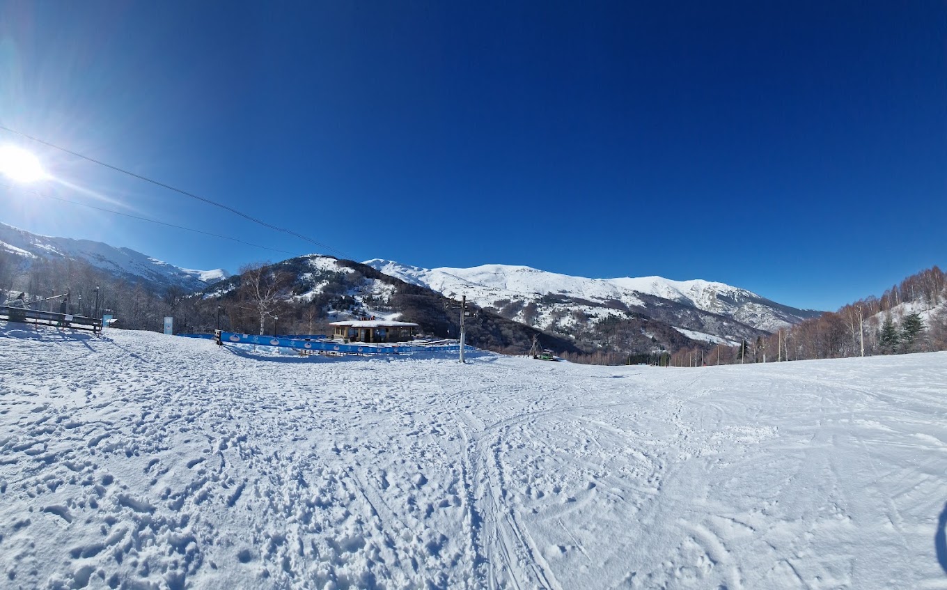 Nizhepole in North Macedonia - a snow covered ski slope with mountains in the background.