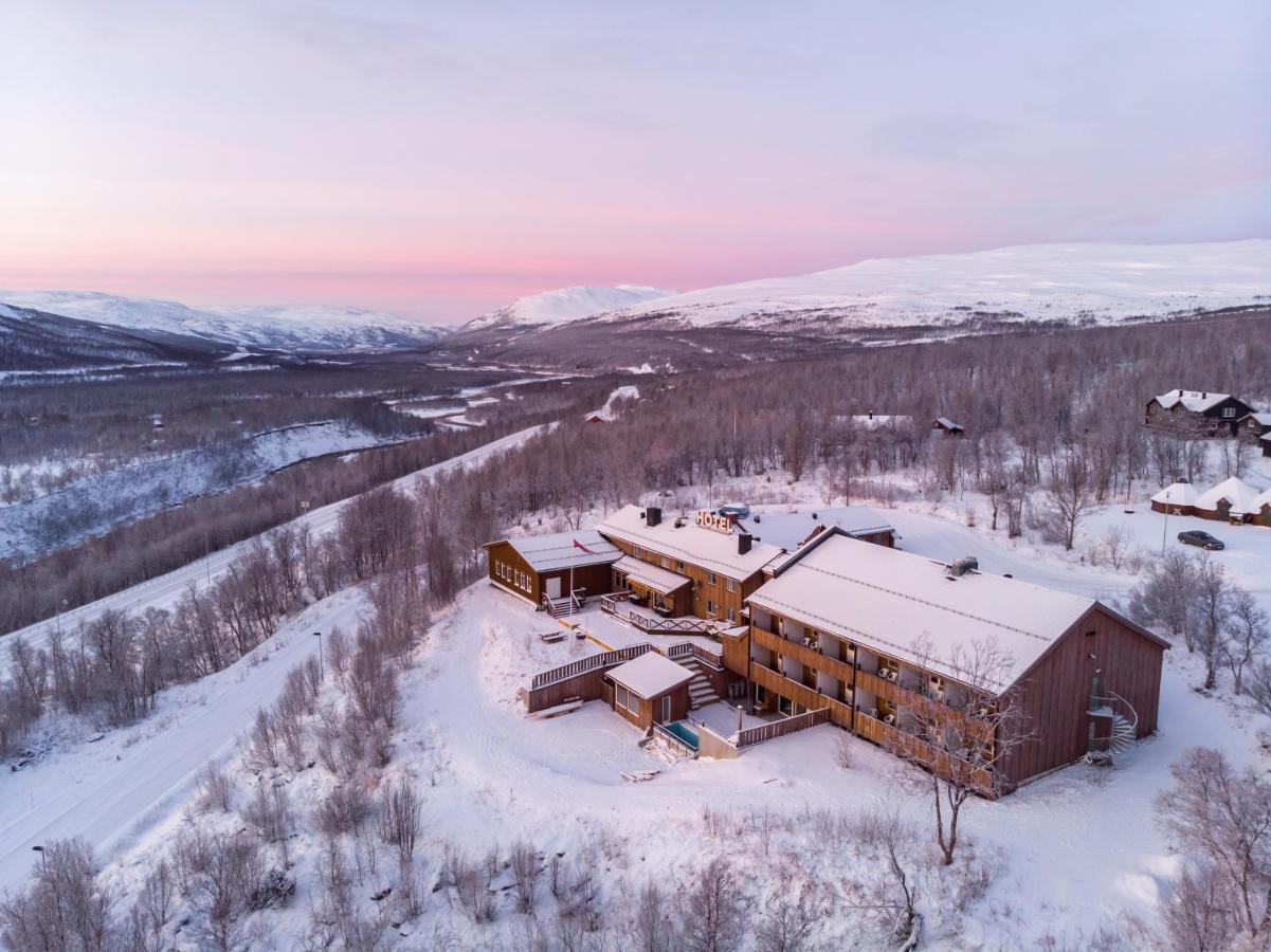 Skaidi in Norway - an aerial view of a house in the mountains.