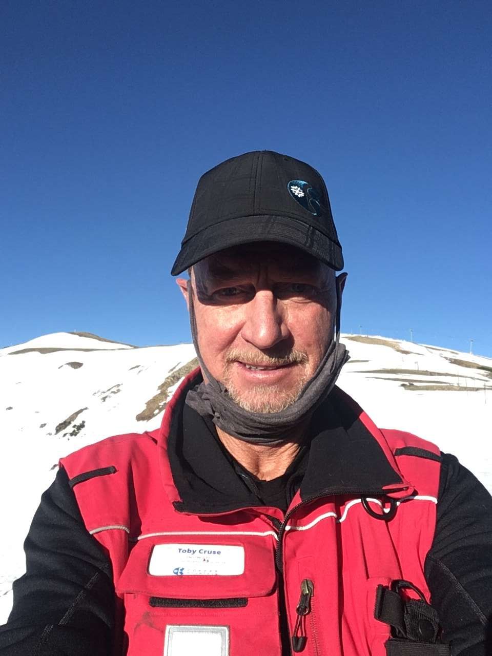 Copper Mountain in USA - a man in a red jacket and black hat.