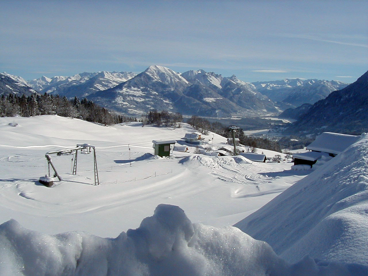 Gurtis | ​Bazora in Austria - a view of a ski area with snow on the ground.