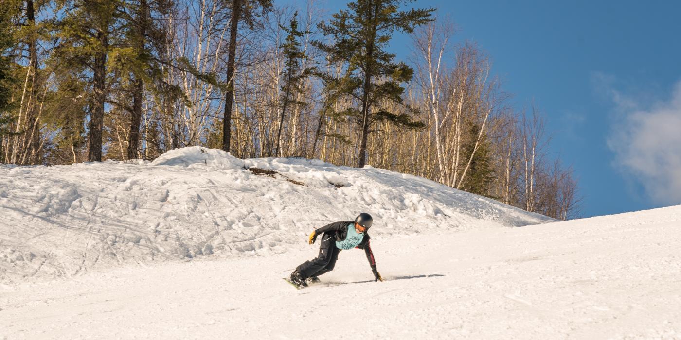 Mystery Mountain in Canada - a person on a snowboard going down a hill.