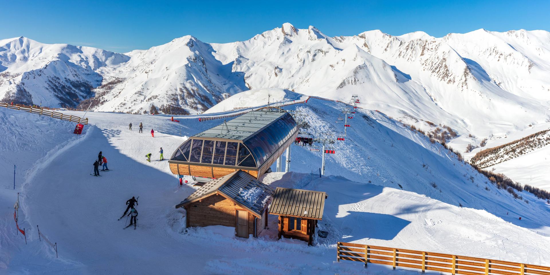 Val d'Allos - Espace Lumière in France - the top of the mountain is covered in snow.