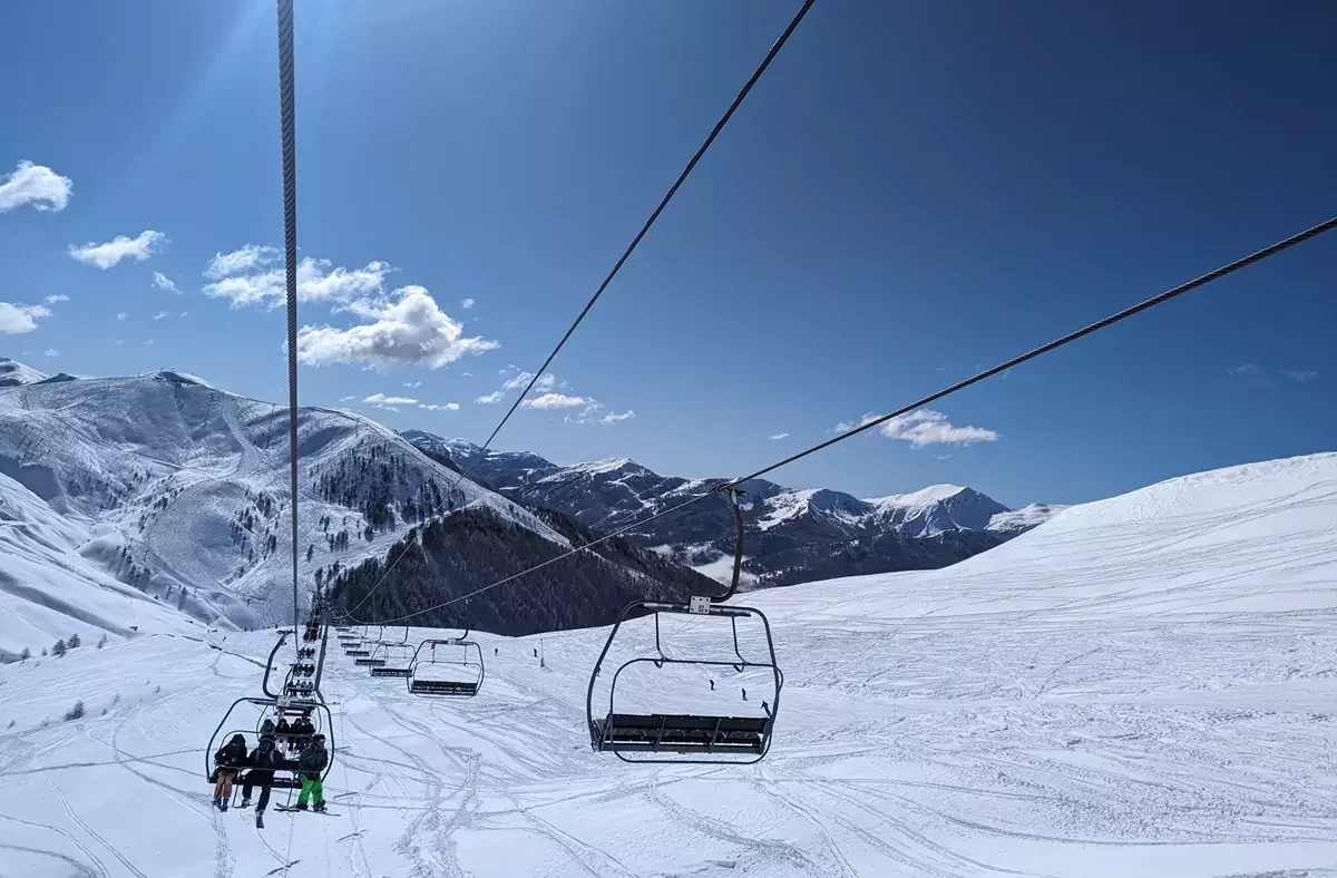 Val d'Allos - Espace Lumière in France - a ski lift going up a snowy slope.