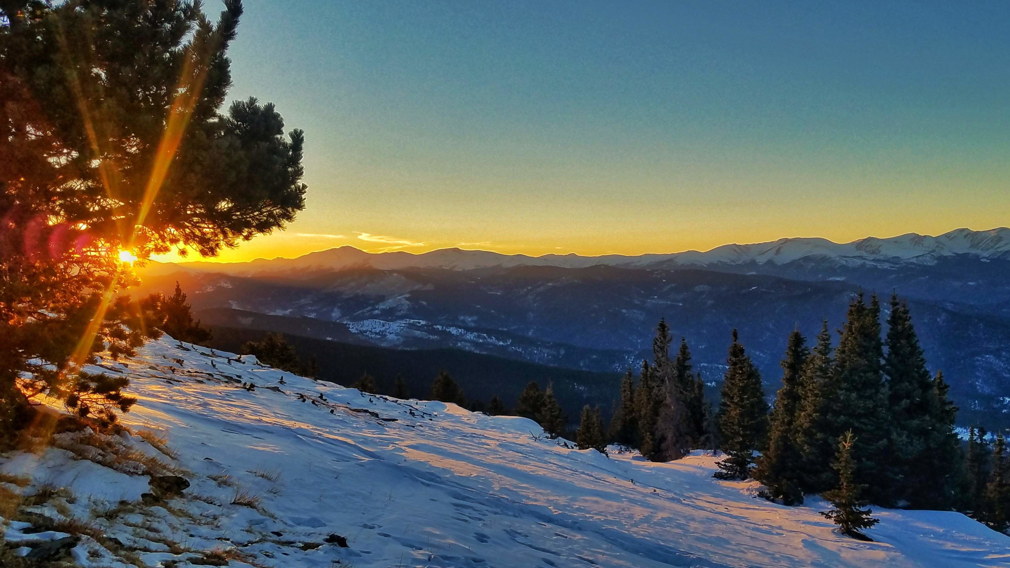 Winter sports scene at Echo Mountain Park, Idaho Springs, Colorado featuring an idyllic winter mountain landscape at a ski resort.