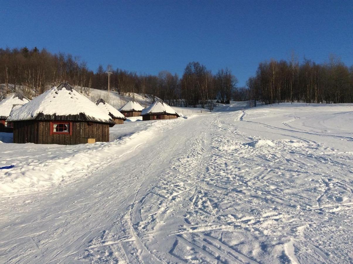 Vestvatn in Norway - a snow covered ski slope with houses in the background.
