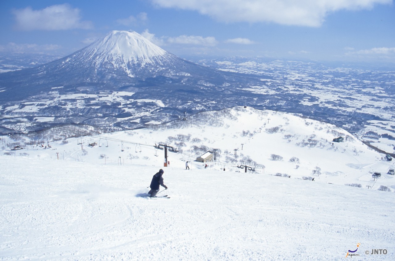 Choei Anpeizan in Japan - a person on a snowboard on a snowy mountain.