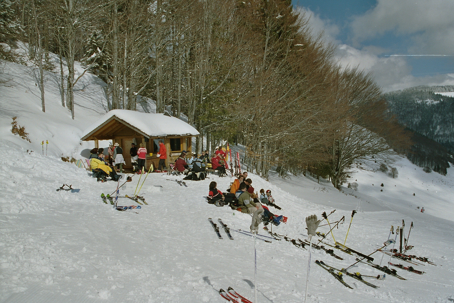 Hofeck – Hof in Germany - a group of people sitting on a snowy hill.