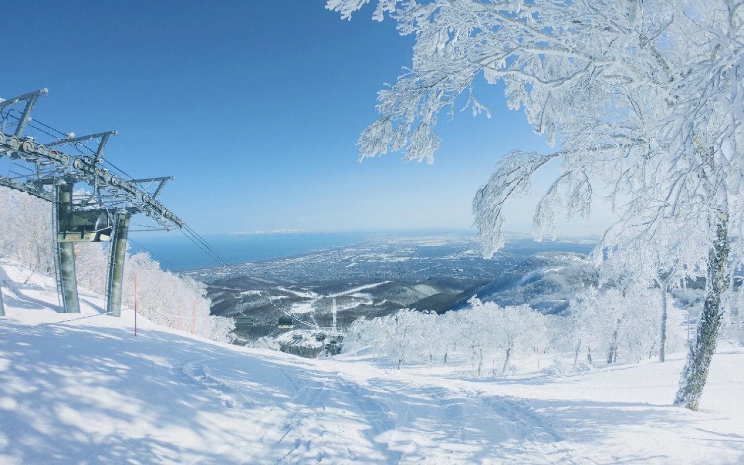 Nishikawa Chomin in Japan - a ski lift going up a snowy mountain.