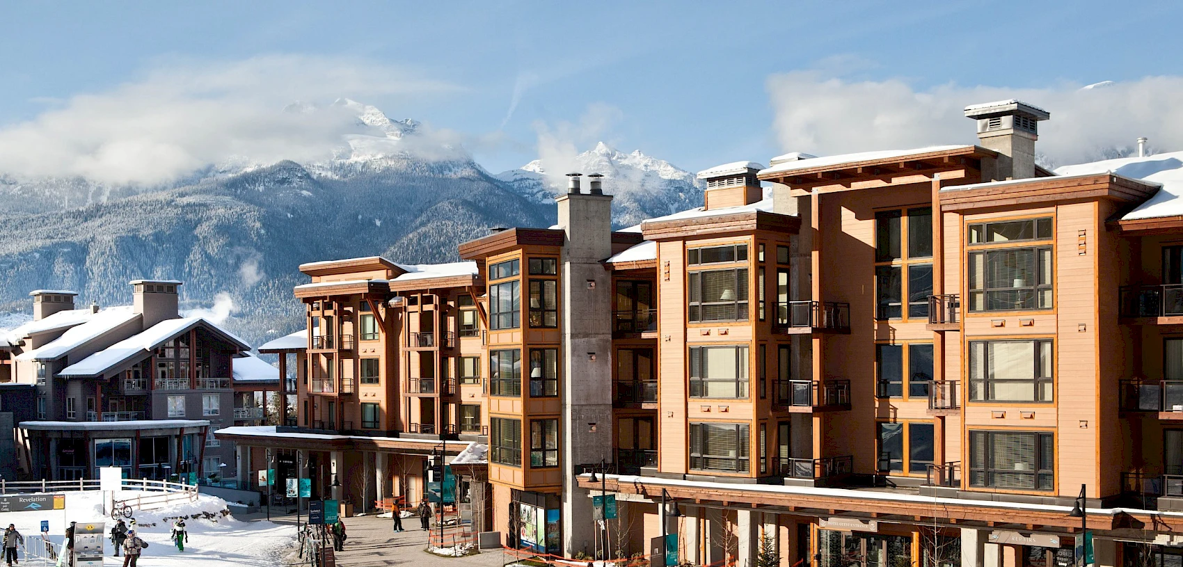 Revelstoke Mountain Resort in Canada - a group of people walking down a snow covered street.