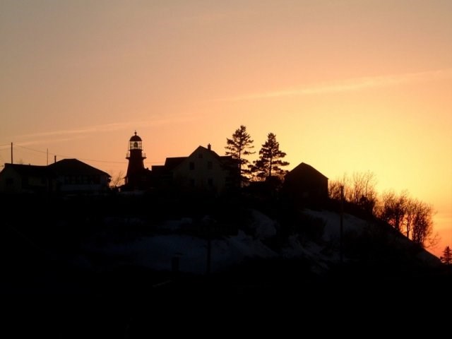 Haute Gaspésie in Canada - the sun is setting over a small town.