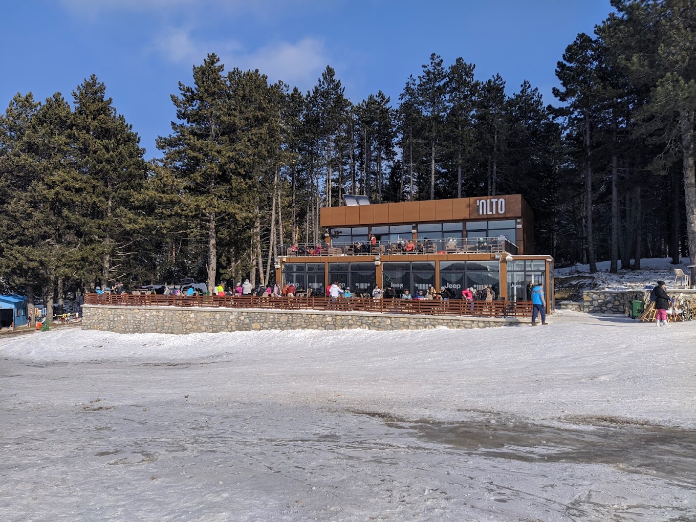 Stanic in North Macedonia: a group of people standing in front of a building.