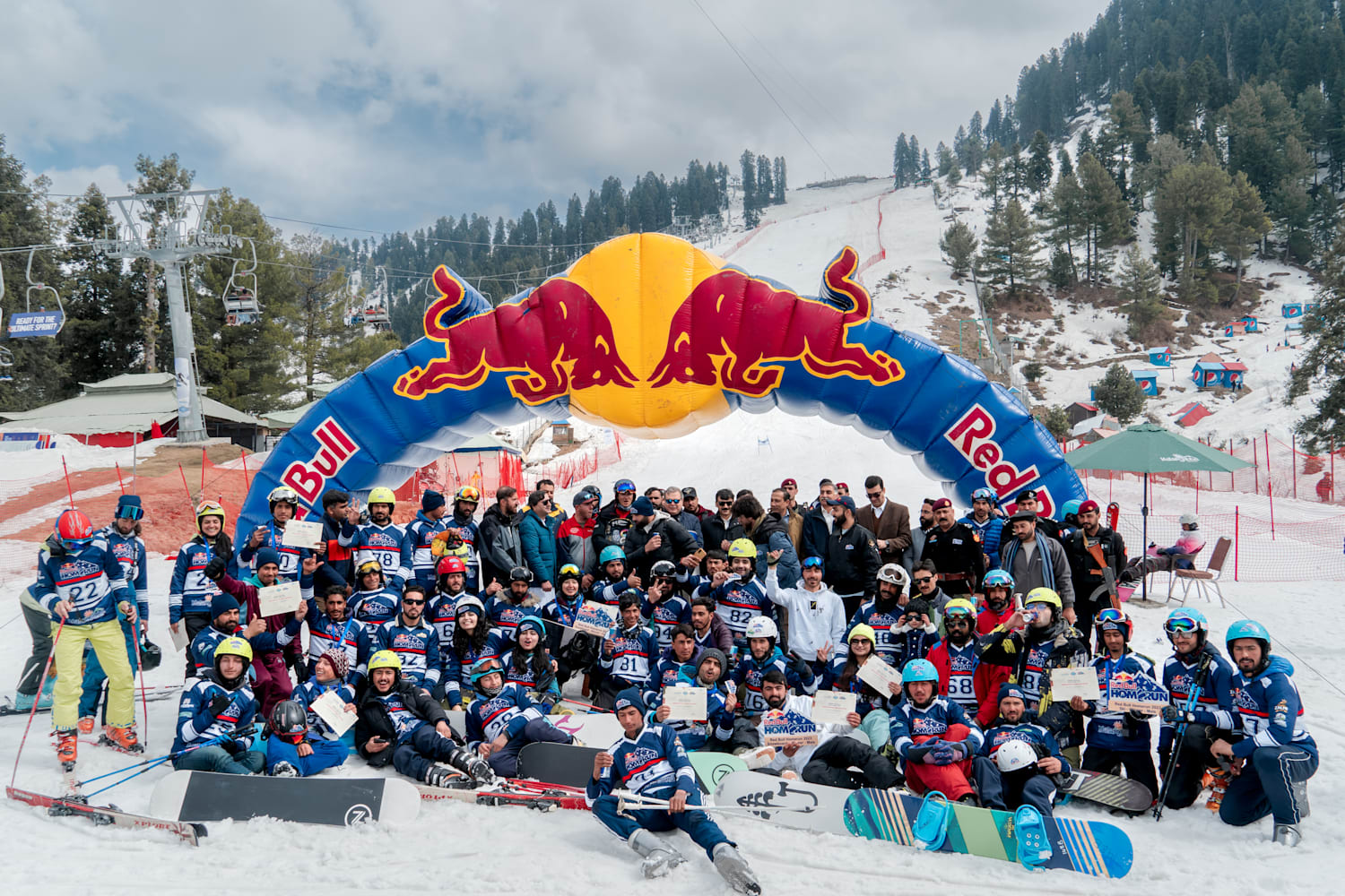 Malam Jabba in Pakistan - a group of people posing for a picture in the snow.