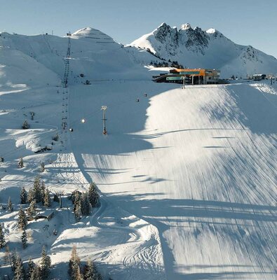 Spieljochbahn Fügen in Austria - a ski slope with a ski lift in the background.