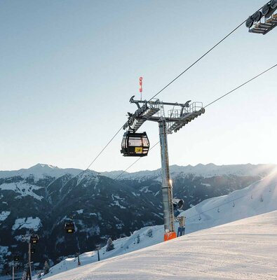 Spieljochbahn Fügen in Austria - a ski lift going up a snowy slope.
