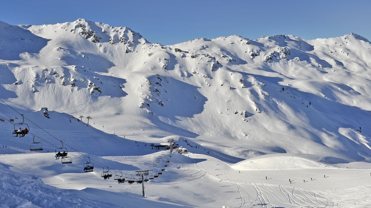 Spieljochbahn Fügen in Austria - a ski lift going up a snowy mountain.